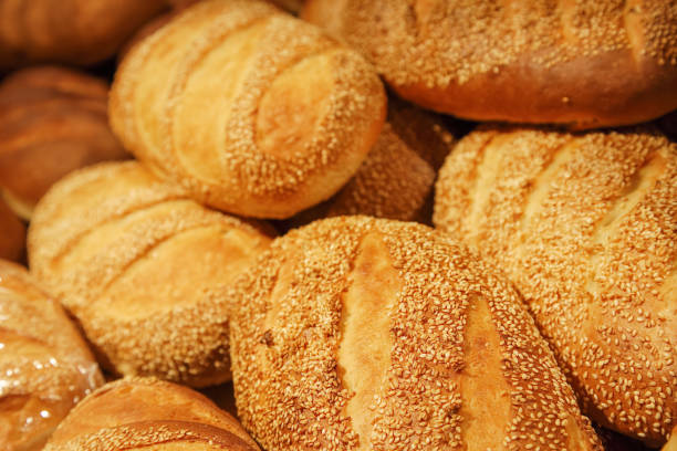 istock Fresh baked white bread close-up with a group of seeds 1145057022