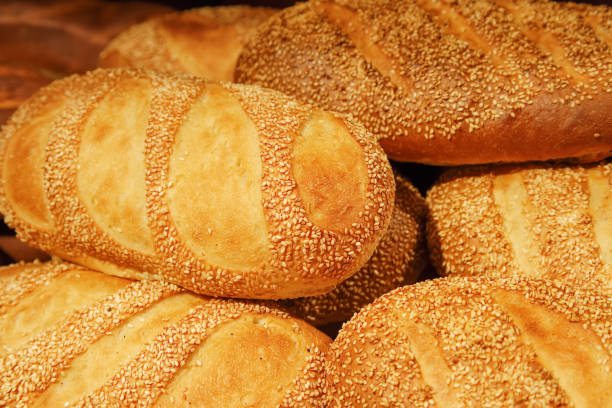 istock Fresh baked white bread close-up with a group of seeds 1145057096