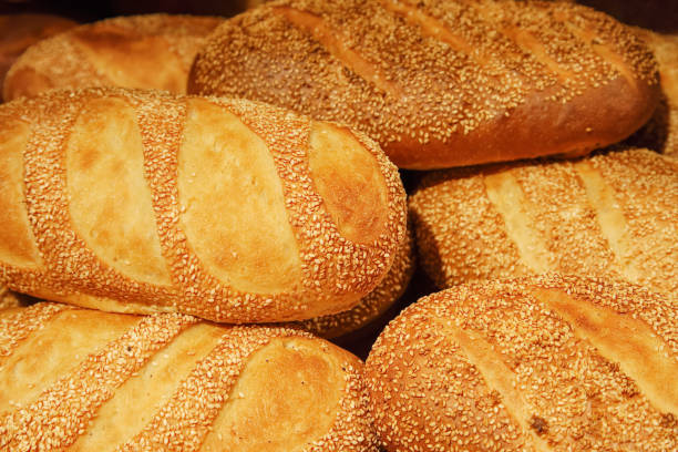 istock Fresh baked white bread close-up with a group of seeds 1145057151