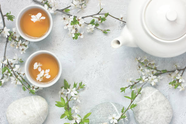 istock Tea mugs and  cherry  flowers in oriental style 1145057809