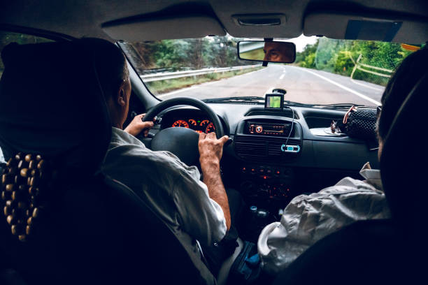 istock Senior man driving car 1145058448