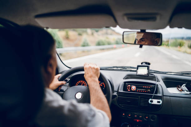 istock Senior man driving car 1145058627