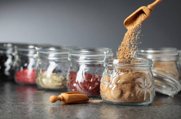 istock Various Oriental spices and herbs in glass jars. 1145059112