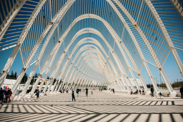 Olympic Complex in Athens, Greece Athens, Greece. 24 March, 2019: Detail of one of the structures built for the 2004 Olympic games, which took place in Athens, Greece. This structure was designed by the Spanish architect Santiago Calatrava. olympic city stock pictures, royalty-free photos & images
