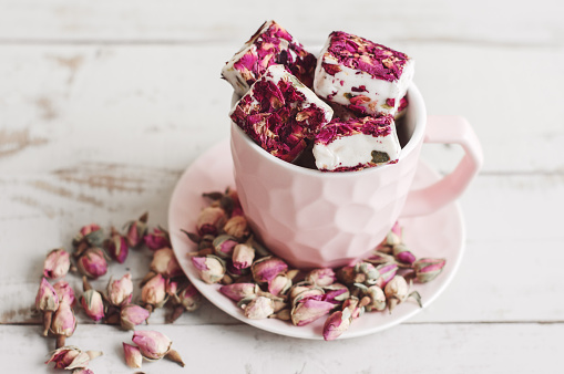 Nougat With Edible Flower Petals In A Pink Coffee Cup And Dried Rose Buds  Lebanese Sweets Turkish Delight Stock Photo - Download Image Now - iStock