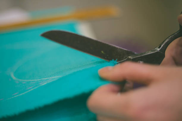 istock Seamstress woman preparing material 1145063966