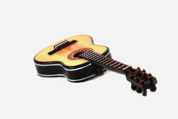 istock acoustic guitar on white background 1145064109
