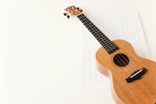 istock Ukulele guitar, music book. Copy space. The view from the top. Soft focus 1145065510
