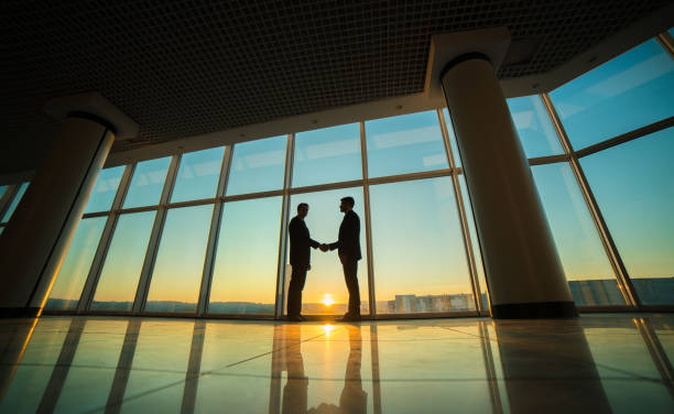 istock The two men handshake in the office on the sunset background 1145066065