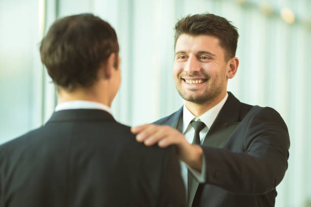 istock The men hold on the shoulder in the office 1145066079