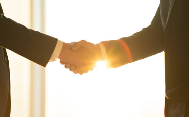 istock The men handshake on the sunny background 1145066129