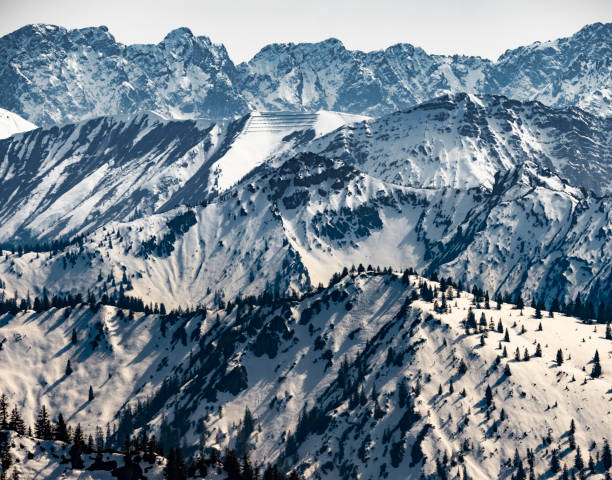 istock snow covered mountains in the alps in spring 1145066347