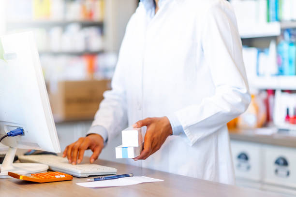 istock Woman pharmacist working at checkout counter 1145067760