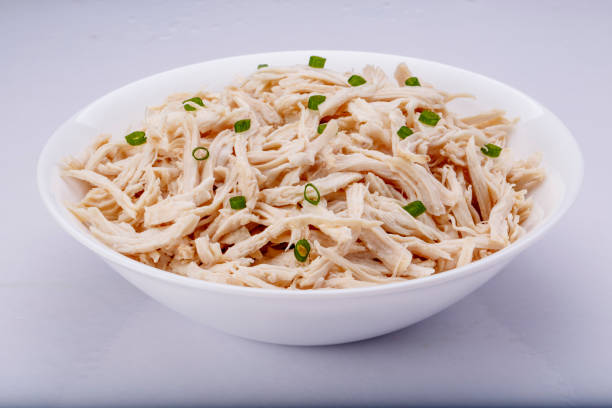 istock Shredded chicken breast in white dish with spices 1145067869