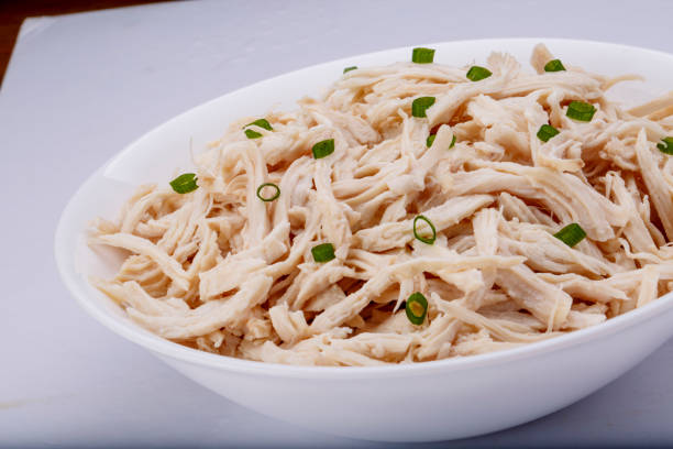 istock Shredded chicken breast in white dish with spices 1145067902