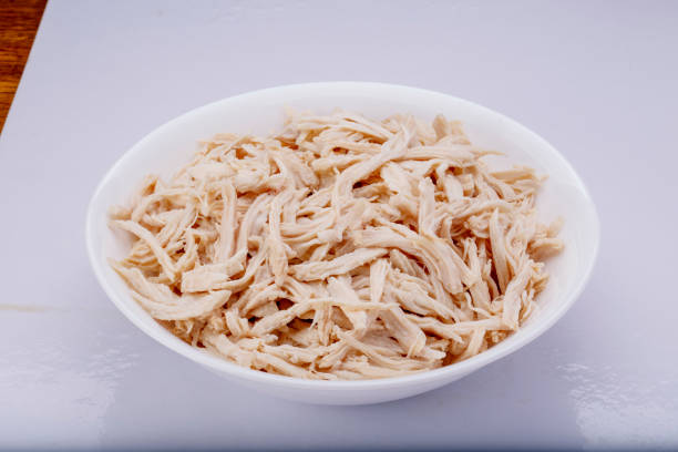istock Shredded chicken breast in white dish with spices 1145067904