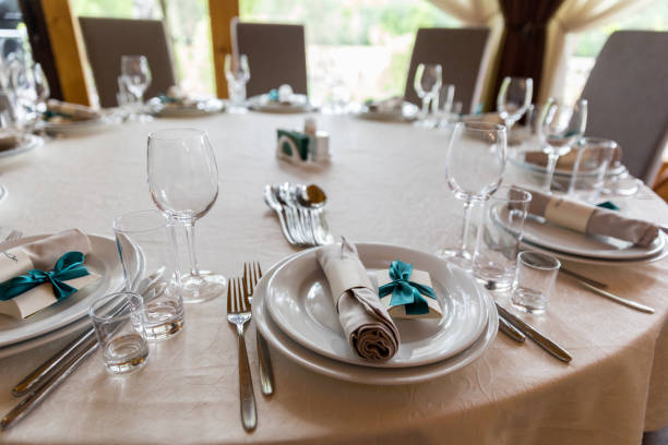 istock Wedding decorated table. Luxury light decor on table in restaurant 1145070125