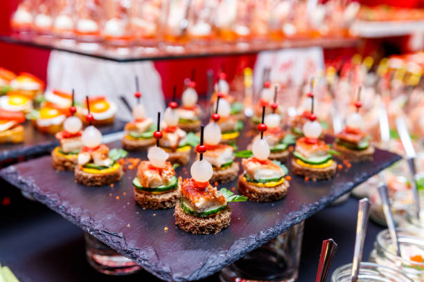 istock appetizers on skewers, desserts. fruit smoothie. Salads. Snacks. Buffet 1145070179