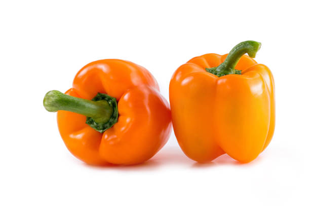 istock tomato orange pepper on the board isolated background 1145070263