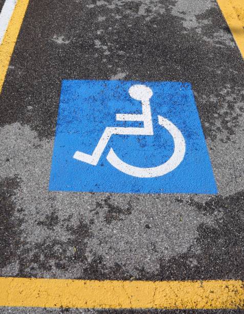 istock wheelchair symbol on a car parking 1145070766