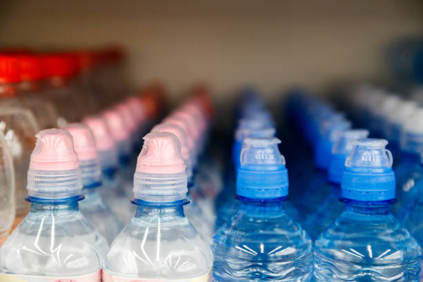 istock Lid plastic water bottle in the market. multi-colored plastic bottle caps 1145070771