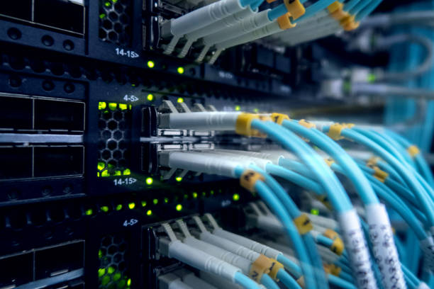 istock Optical cable close-up. Network devices technology, optical fiber cable and switch. 1145070790