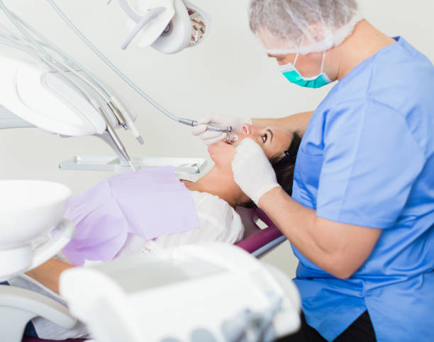 istock adult dentist checking teeth 1145074086