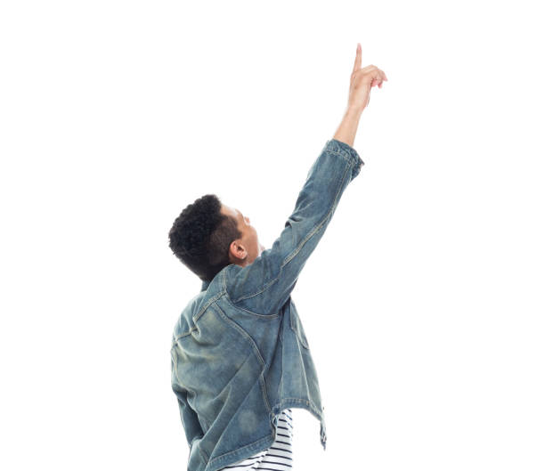 istock Good looking tall black man wearing denim jacket - pointing up 1145077321