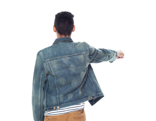 istock Good looking tall black man wearing denim jacket - pointing 1145077348
