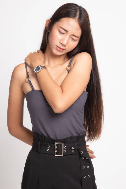 istock Young Asian woman got back pain. 1145078800