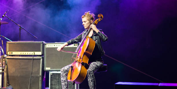 istock Young woman playing cello on the stage 1145079453