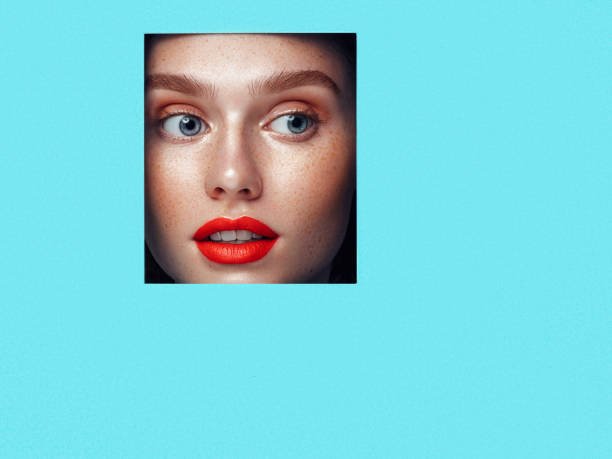 istock Beautiful woman looking through a hole 1145080323