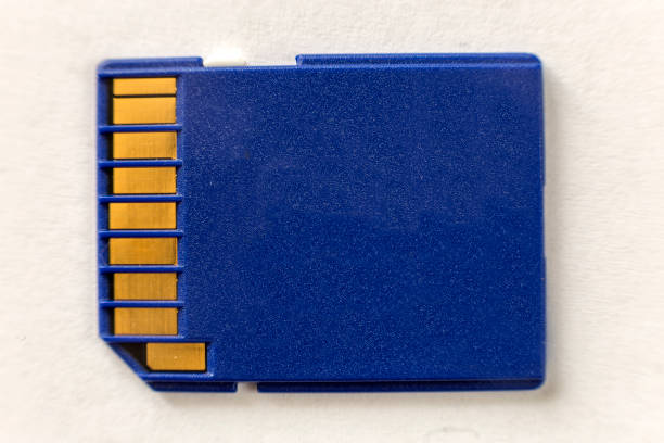 istock Close-up of blue micro SD memory card isolated on white copy space background. Modern electronic technology, information saving concept. 1145081479