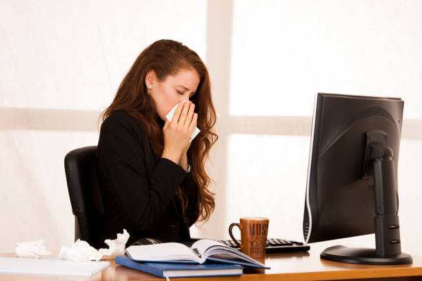 istock il woman suffering at work behind the desk in her office 1145083061