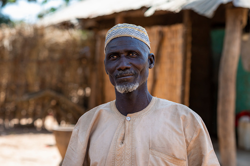 Gabu Region, Republic of Guinea-Bissau - February 7, 2018: Portrait of an old man, in the village of Mandina Mandinga in the Gabu Region, Guinea Bissau