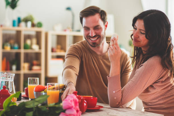 istock Romantic couple enjoying food and drinks on a date 1145086285
