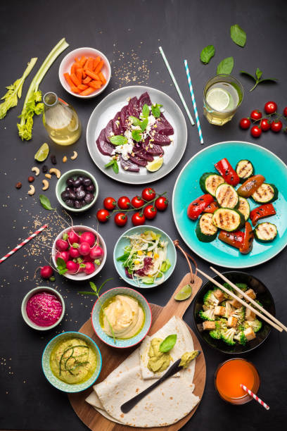 istock Colorful vegetarian feast dinner table from above 1145086579