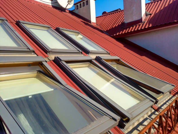 istock Red tiled house roof with attic windows. Roofing construction, window installation, modern architecture concept. 1145087861