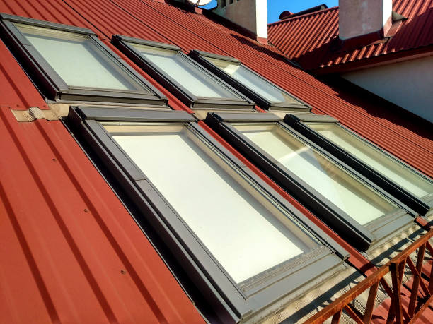 istock Red tiled house roof with attic windows. Roofing construction, window installation, modern architecture concept. 1145087872