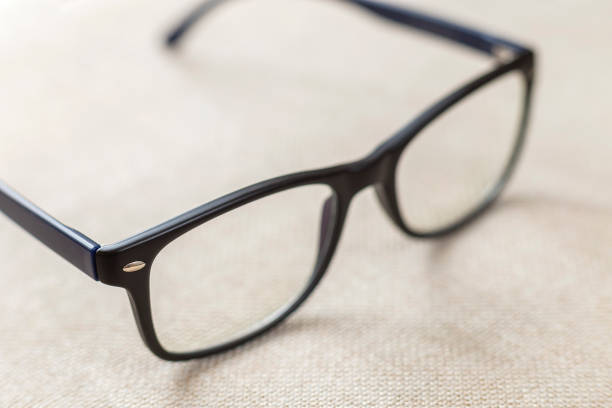 istock Reading spectacles, fashionable eyeglasses isolated on blurred white copy space background. 1145087886