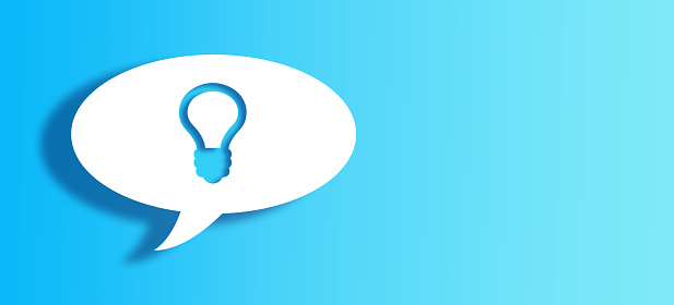 White Chat Bubble With Cut Out bulb Shape Over Blue gradient Background with large copy space.