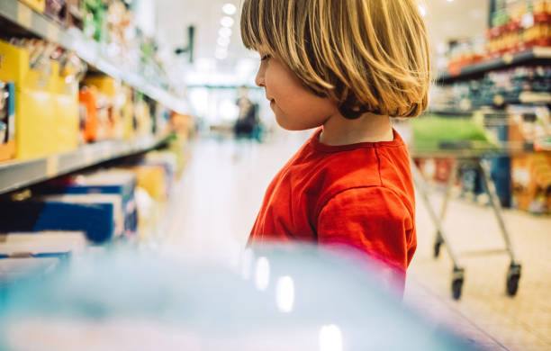 istock Toddler boy at the grocery store 1145088531