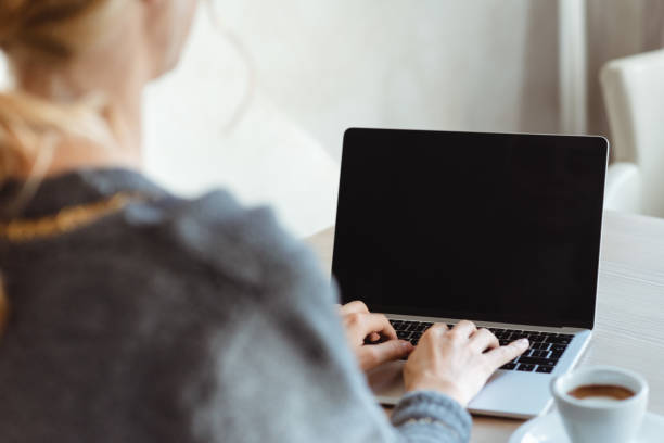 istock Young woman using laptop with copy space on it 1145088561