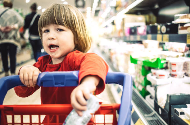 istock Toddler boy at the grocery store 1145089252