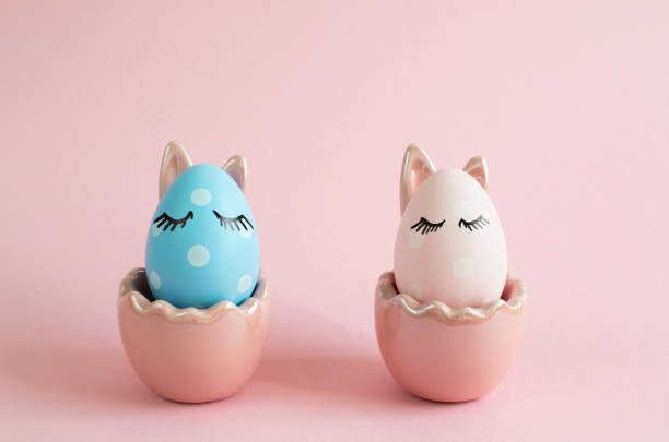 istock Easter decorated eggs with close eyes on pink background 1145089306