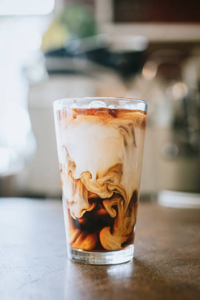 Fresh Cold Brew Coffee A cool refreshing glass of iced single origin coffee to enjoy on a hot summer day.  Vertical image. iced coffee stock pictures, royalty-free photos & images