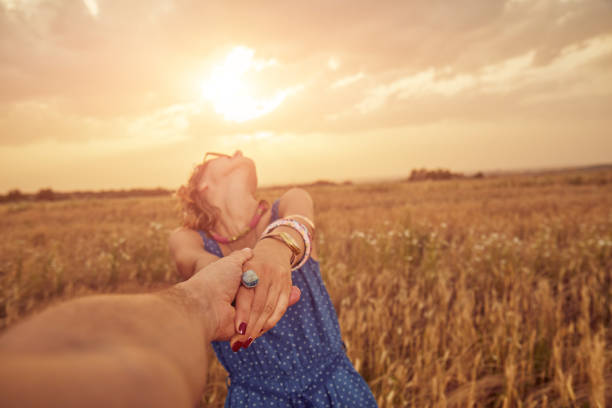 istock Young couple enjoying in a wheat field. 1145091699
