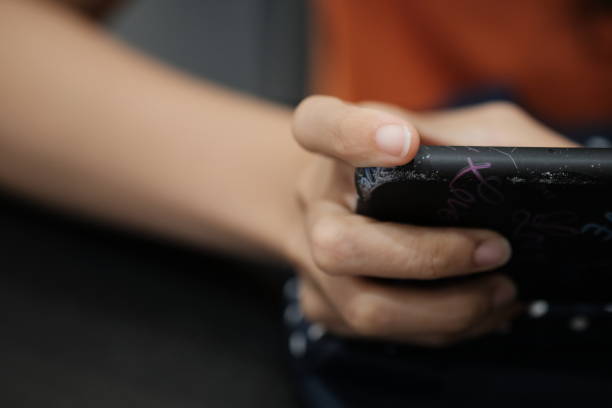 istock Woman enjoy with mobile game in hands 1145094331