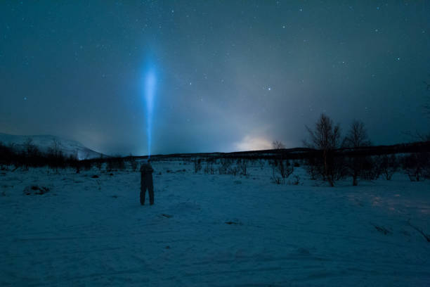 istock Person with cone of light from flashlight 1145094479