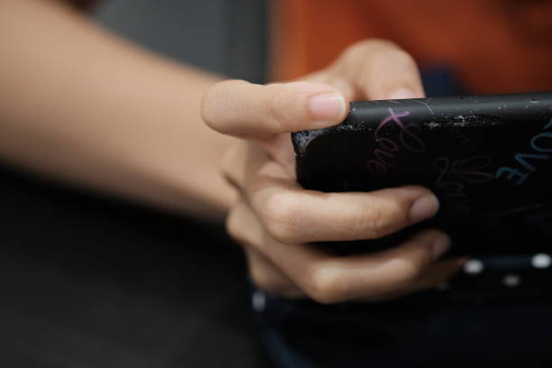 istock Woman enjoy with mobile game in hands 1145094877